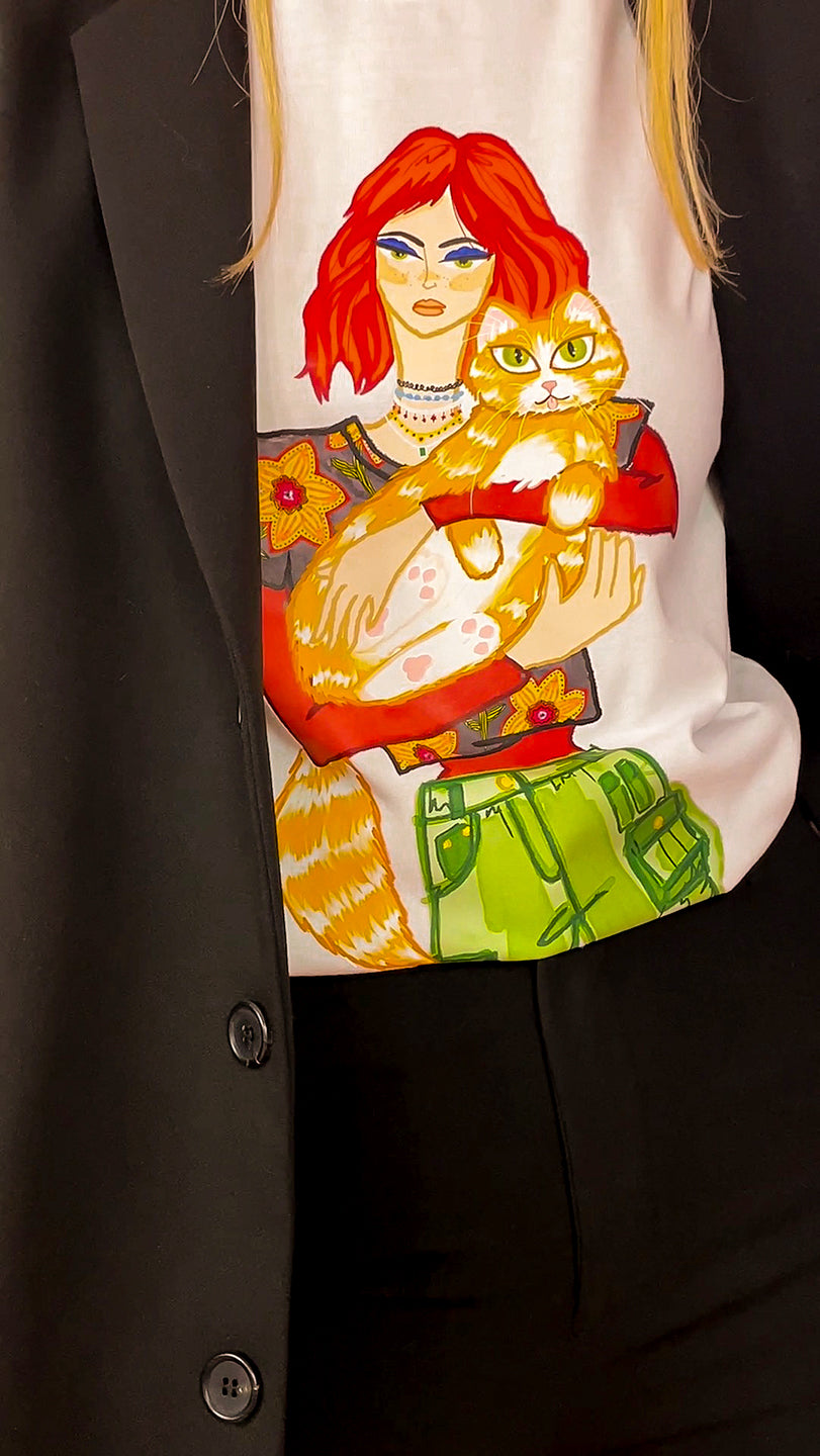 Raven T-Shirt,Bold and Confident,Youthful Redhead Girl,Orange Cat Illustration,Powerful Look,Badass Style,100% Cotton Comfort,Size-Inclusive,XS to XXL Sizes,Professional Attire,Black Power Suit,UAE Fashion,Trendy Outfit,Unique Artwork,Women's Empowerment,Stylish Statement Tee,Loyal Companion,Shop Now in UAE,Fashionable Choices,Expressive Fashion