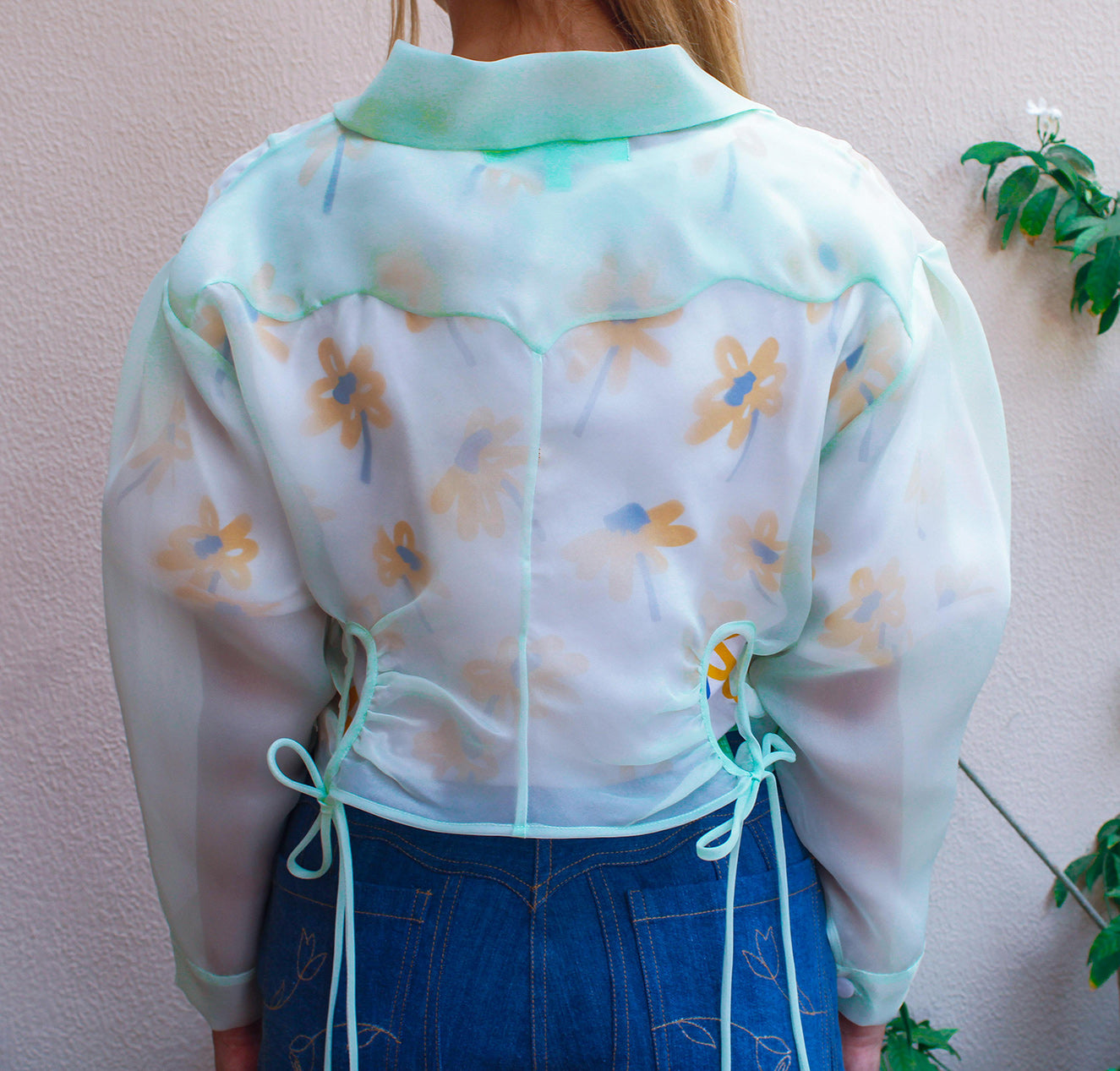 Botanical Jacket,Garden Party Attire,Botanical Garden Collection,Lightweight Organza,Inverted Box Pleat,Tie String Closure,Whimsical Yoke,Summer Fashion,Beach Party Outfit,Functional Pockets,Elegance and Utility,UAE-Based Design,GCC Shipping,Playful Aesthetic,Floral Inspired,Carefree Summer Style,Enchanting Silhouette,Versatile Elegance,Nature-Inspired,Chic and Breezy