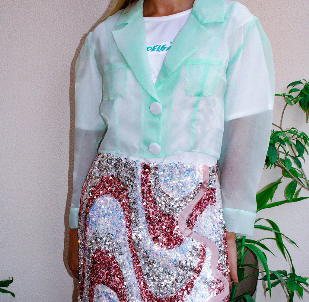 Botanical Jacket,Garden Party Attire,Botanical Garden Collection,Lightweight Organza,Inverted Box Pleat,Tie String Closure,Whimsical Yoke,Summer Fashion,Beach Party Outfit,Functional Pockets,Elegance and Utility,UAE-Based Design,GCC Shipping,Playful Aesthetic,Floral Inspired,Carefree Summer Style,Enchanting Silhouette,Versatile Elegance,Nature-Inspired,Chic and Breezy