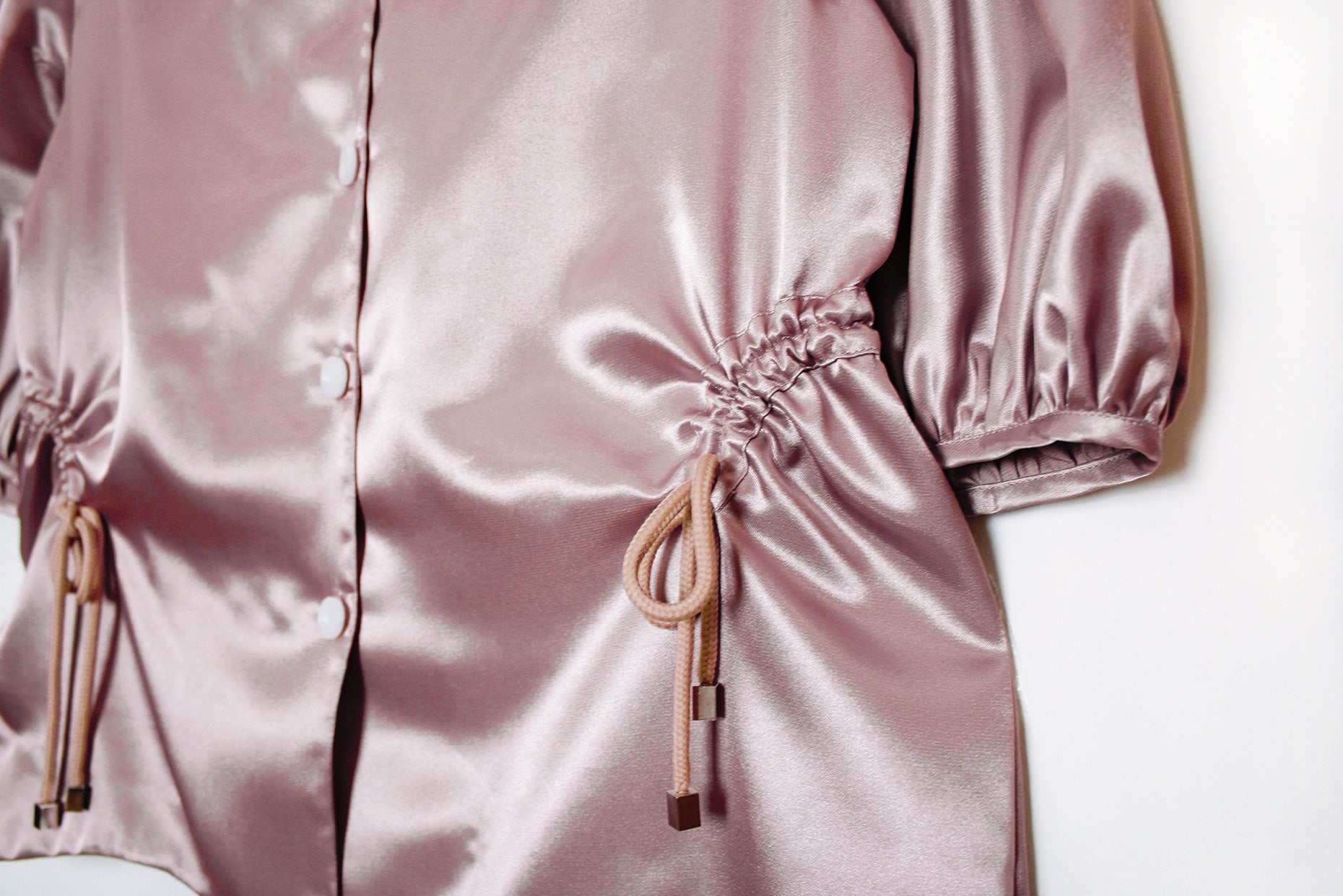 Gardenia Blouse,Botanical Garden Collection,Mauvy Pink Color,Adjustable Waist,Drawstrings,Asymmetrical Hemline,Button Closure,Soft and Silky Fabric,Casual Chic,Special Gathering,Summer Fashion,Stylish Design,Versatile Wear,Worldwide Shipping,UAE-Based Shipping,Doppelganger Design,Elegant Blouse, Comfortable Elegance,On-Trend Style